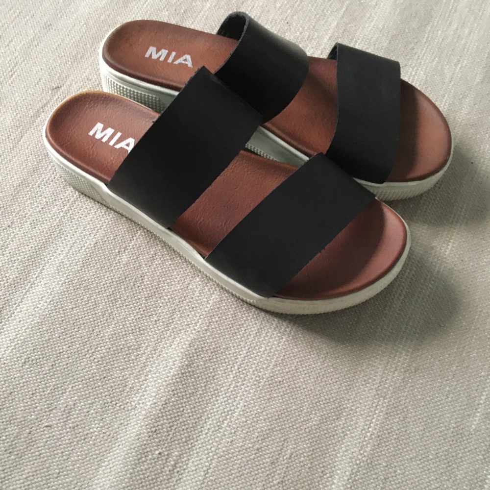 Elegant black leather slides